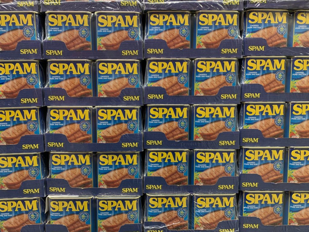 Email tip number one: avoiding the spam folder. A picture of a wall of Spam cans. Don't let your email end up in the spam folder by using a good subject line.