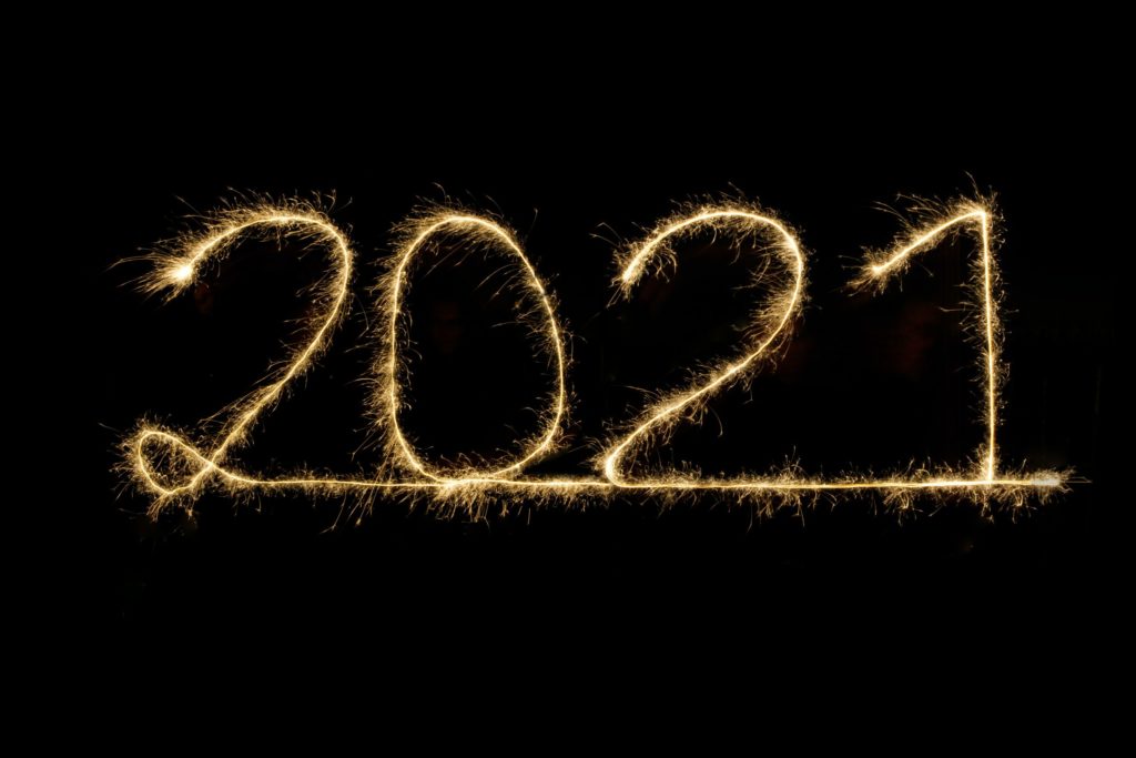 The number "2021" illuminated in light.