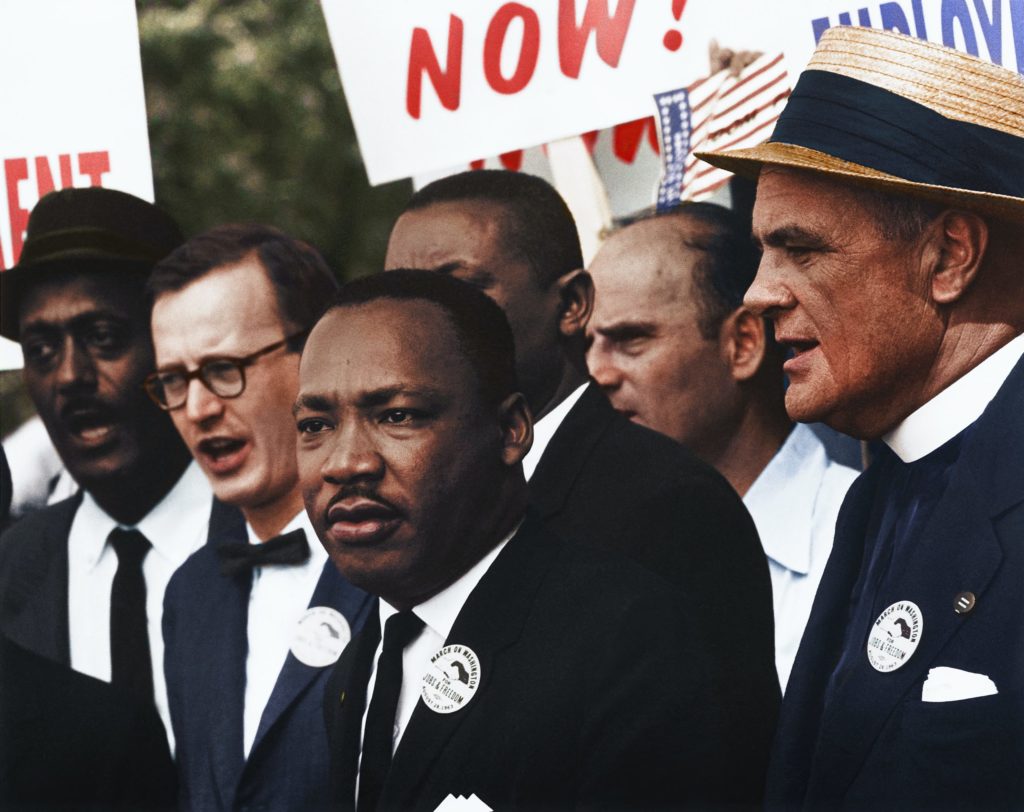 [Civil Rights March on Washington, D.C. [Dr. Martin Luther King, Jr. and Mathew Ahmann in a crowd.], 8/28/1963" Original black and white negative by Rowland Scherman. Taken August 28th, 1963, Washington D.C, United States (The National Archives and Records Administration). Colorized by Jordan J. Lloyd. U.S. Information Agency. Press and Publications Service. ca. 1953-ca. 1978. https://catalog.archives.gov/id/542015