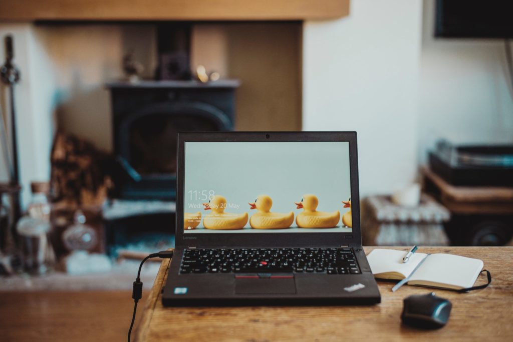 A laptop screen showing rubber duckies lined up in a row.